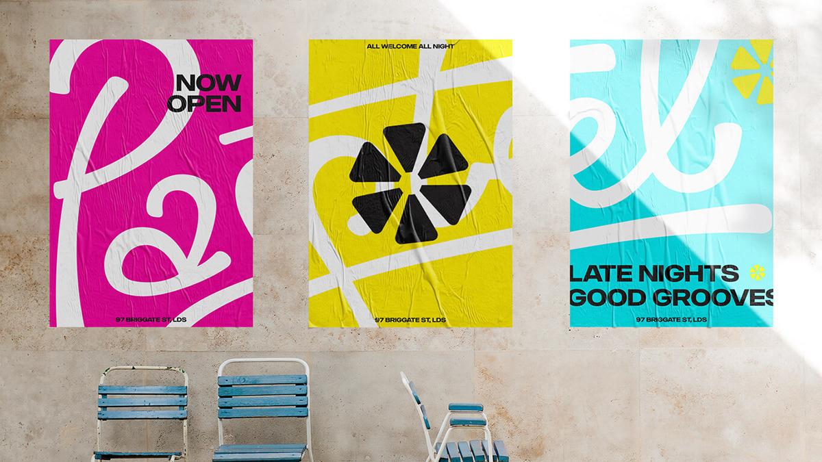 Pastel branded posters on a wall