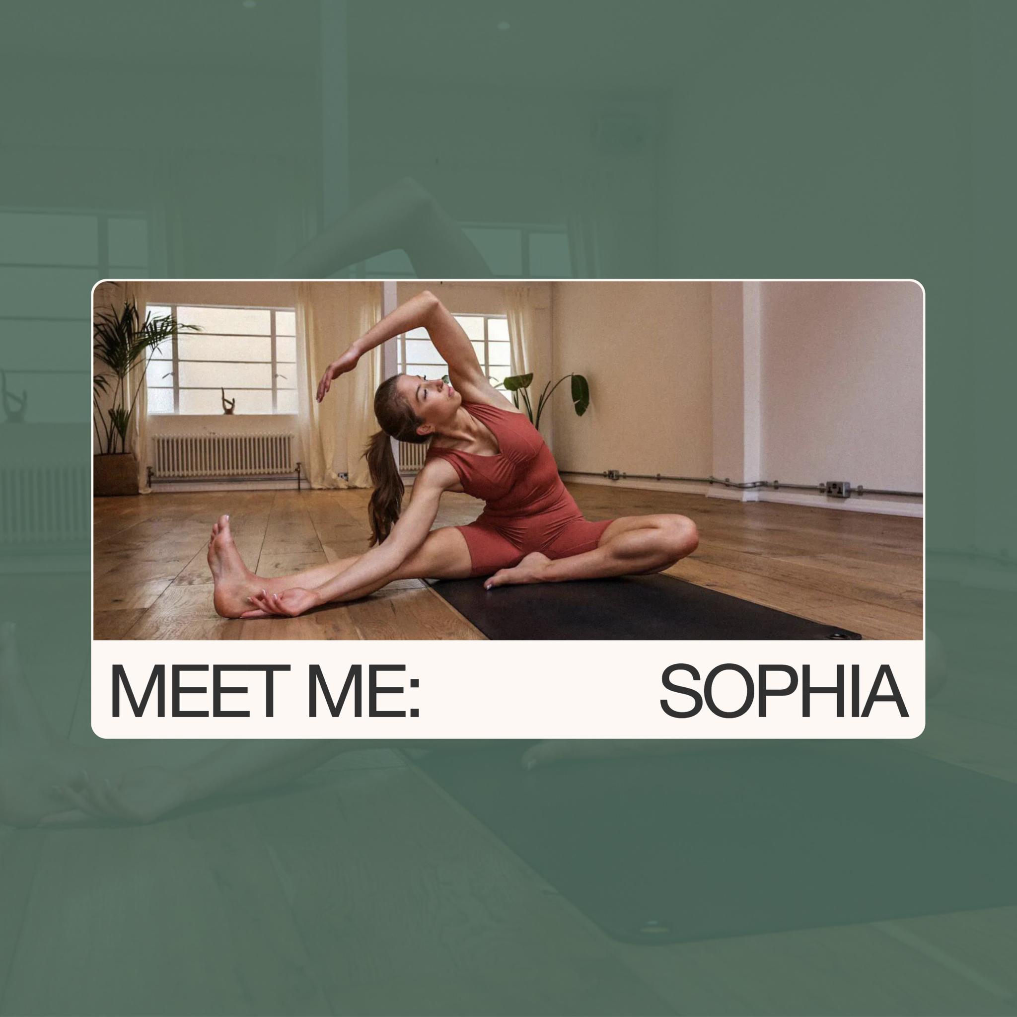 Photo of yoga teacher in an extended side angle with a bind on a white studio background.