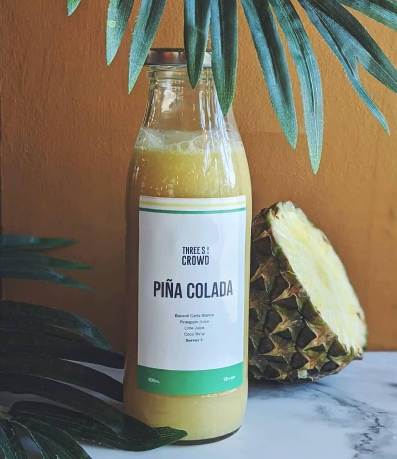 Three's A Crowd branded Pina Colada cocktail label