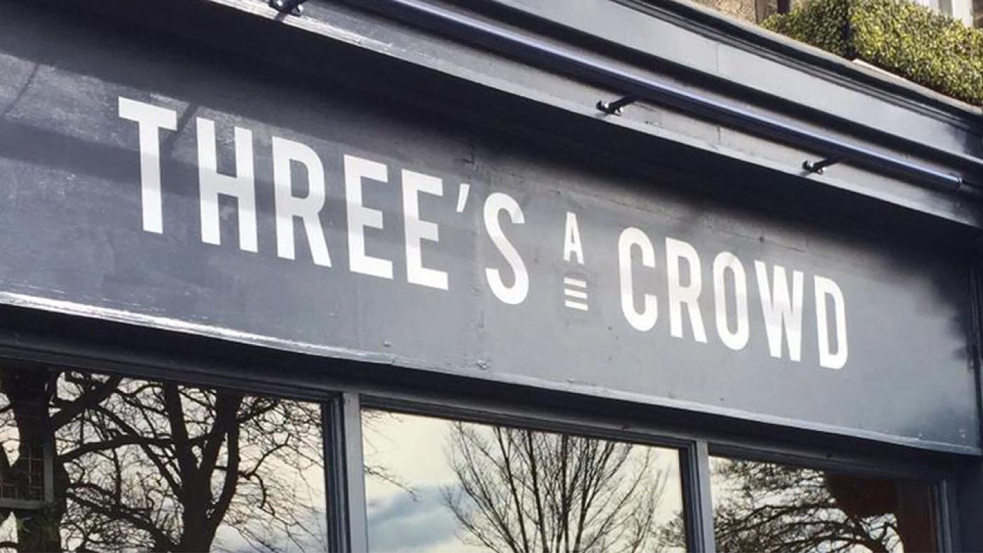 Three's A Crowd storefront