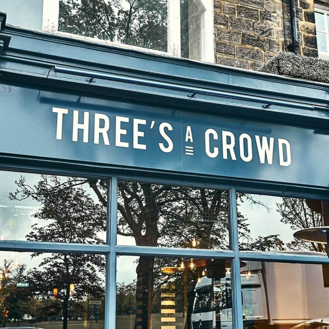 Three's A Crowd storefront